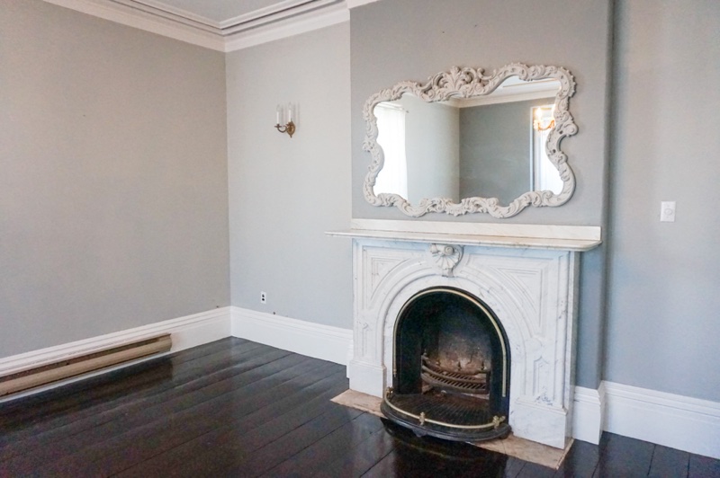 grey livingroom with a grey marble fireplace