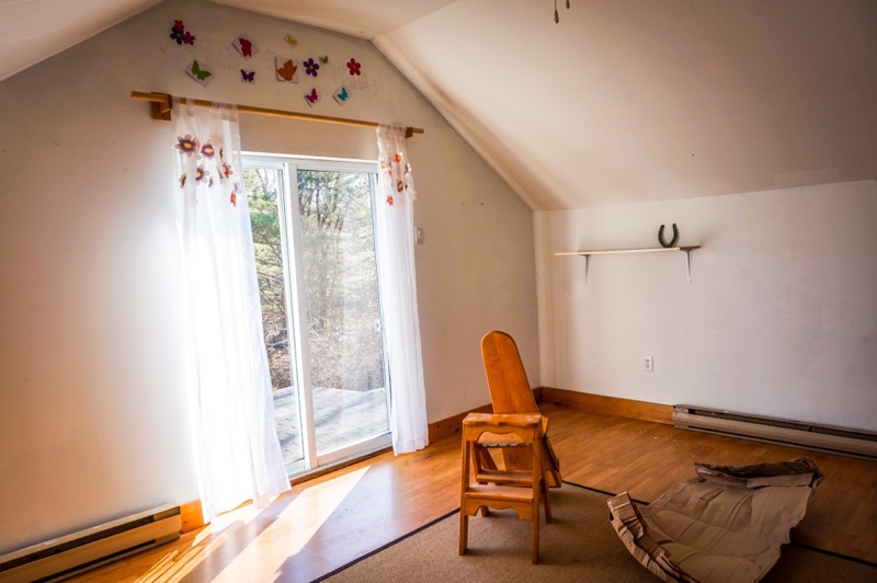 room with patio door and butterfly stickers above it
